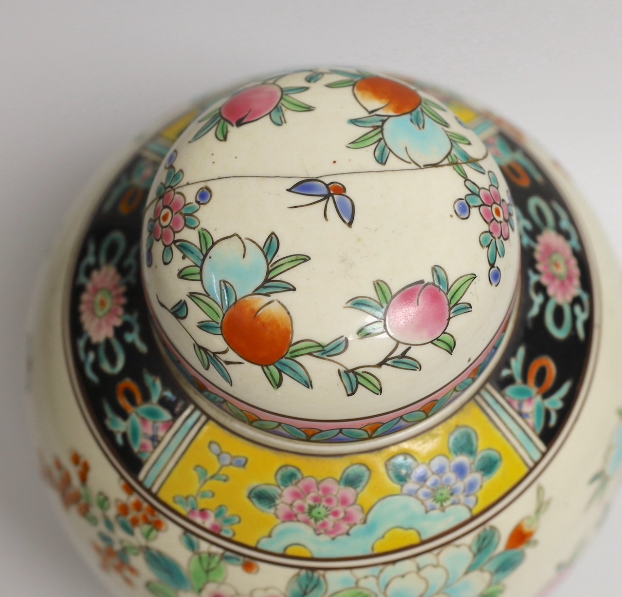 An early 20th century Japanese famille rose jar and cover, 23cms high
